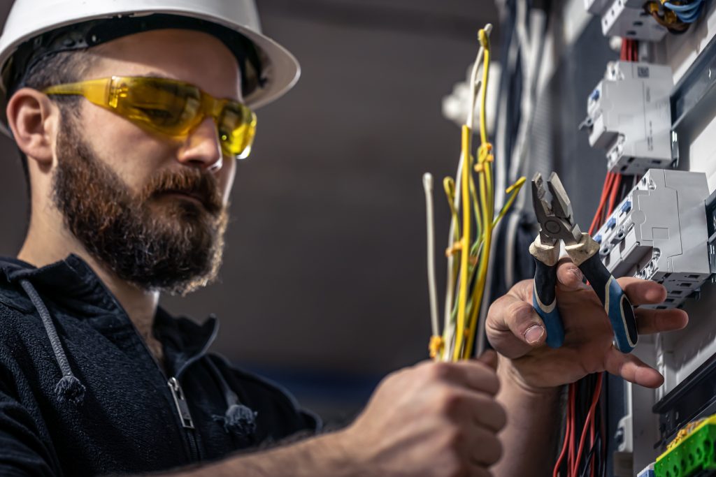 a male electrician works in a switchboard with an 2025 03 31 09 57 18 utc 1