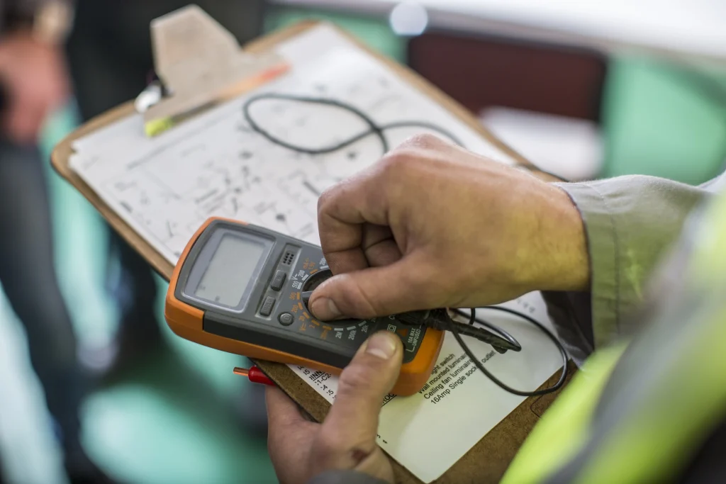 Electrician holding mobile device 2024 09 18 14 54 30 utc scaled